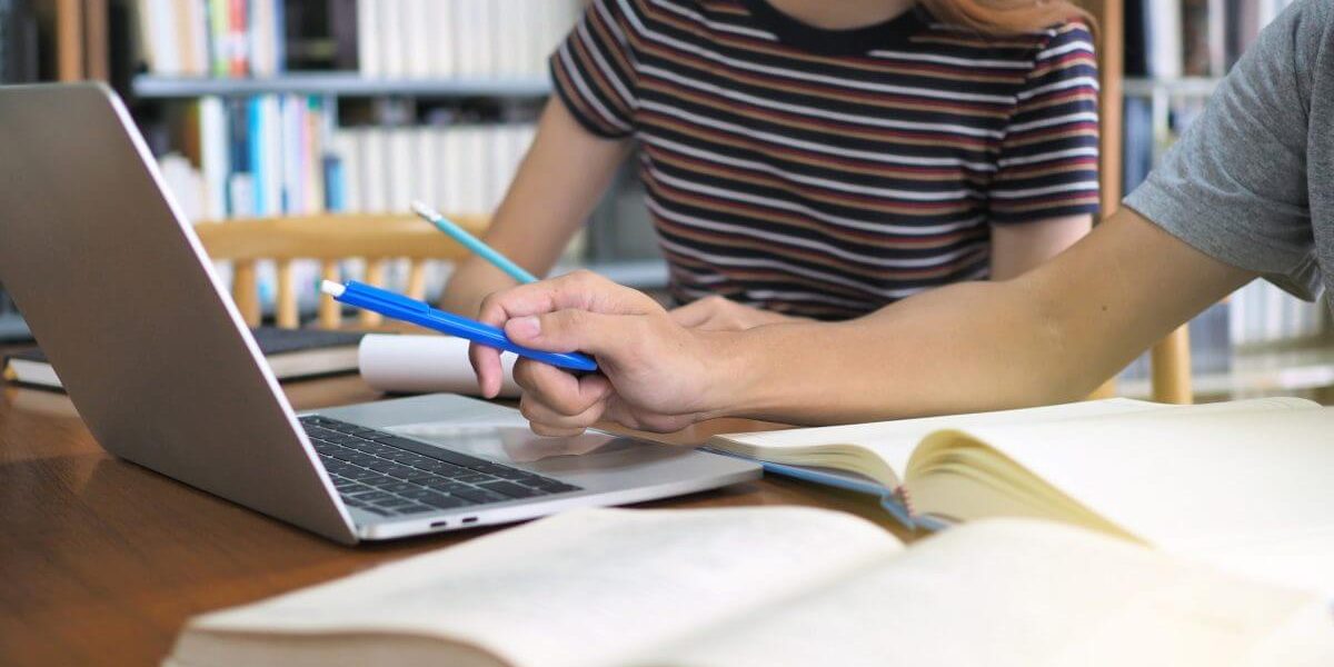 students reading in library
